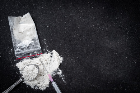 Hard drugs on dark tableの写真素材