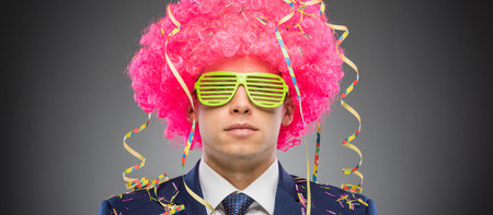 Funny businessman in pink wigの写真素材
