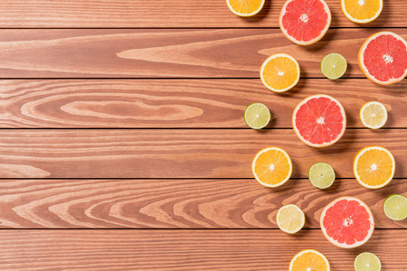 Sliced ??fruits on brown wooden tableの写真素材