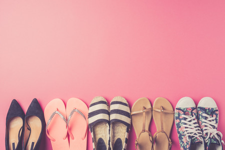 Collection of women's shoes on pink backgroundの写真素材
