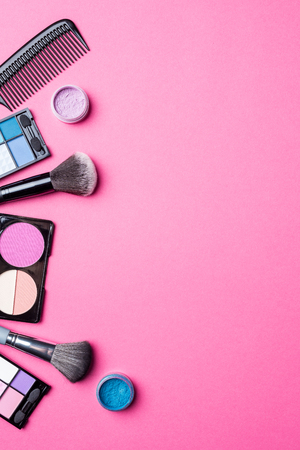 Makeup products on pink background. Top viewの写真素材