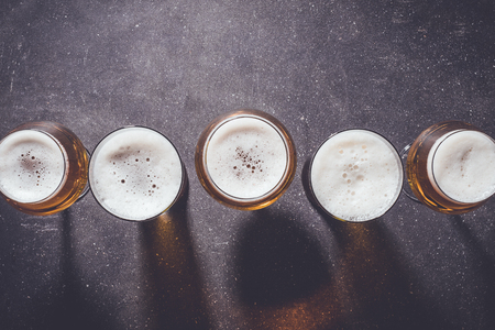 Beer glasses on a dark tableの写真素材