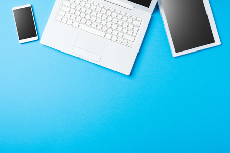 Digital devices on blue backgroundの写真素材