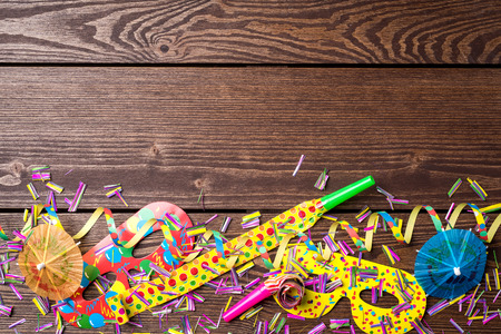 Colorful party background on wooden tableの写真素材