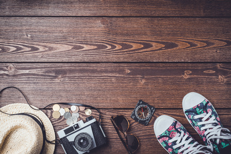 Travel accessories on wooden tableの写真素材