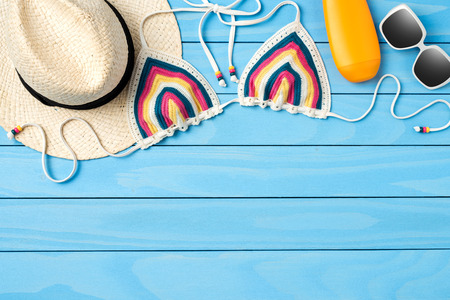 Beach accessories on blue wooden backgroundの写真素材