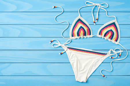 Swimsuit on blue wooden backgroundの写真素材