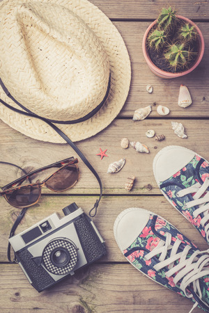Travel accessories on an old wooden backgroundの写真素材
