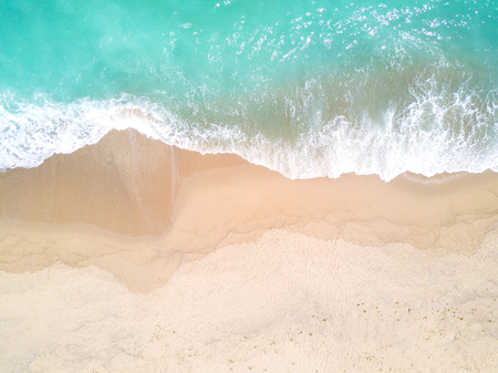Aerial view of sandy beach and ocean with wavesの写真素材