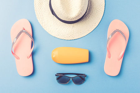 Beach accessories on blue backgroundの写真素材