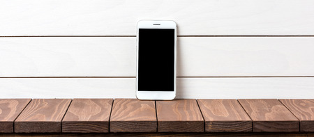 Modern smart phone on wooden backgroundの写真素材