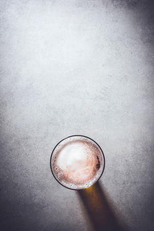 Beer glass on gray stone backgroundの写真素材