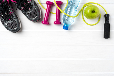 Fitness accessories on white wooden tableの写真素材