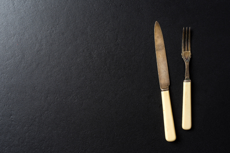 Kitchen utensils over black elegant backgroundの写真素材