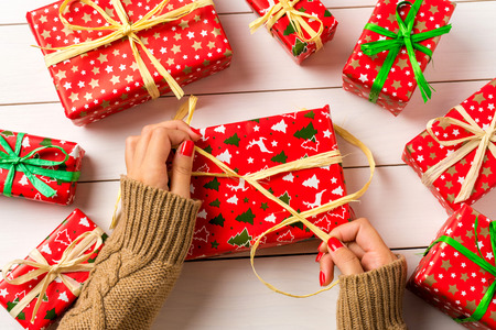 Woman wrapping Christmas present