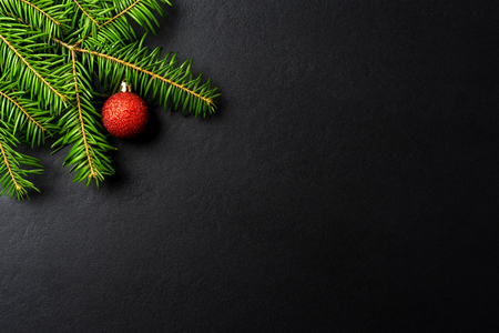 Christmas background with tree and red Christmas ballの写真素材