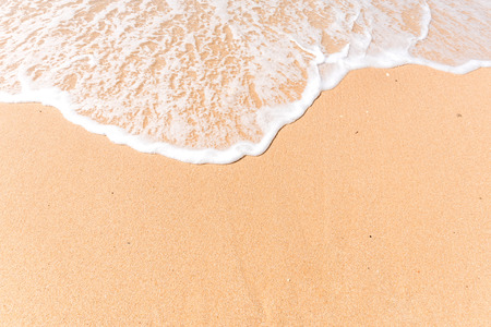 Tropical beach background with soft wave and white sandの写真素材