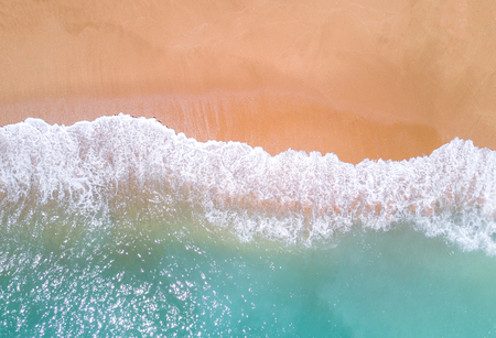 Aerial view of tropical sandy beach and ocean.