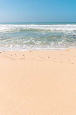 Tropical beach background with soft wave, white sand and blue skyの写真素材