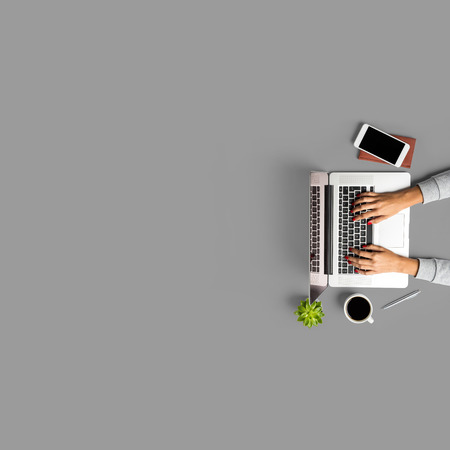 Overhead shot of woman working on laptop.の写真素材