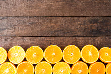 Fresh oranges on wooden table with copyspace