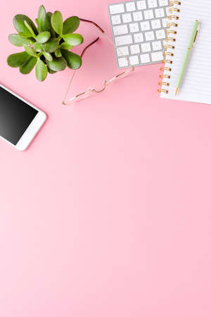 Female desktop with fashion accessories on white backgroundの写真素材