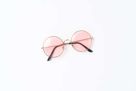 Round sunglasses on white background. Flat lay