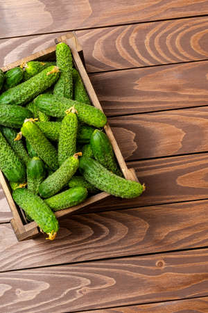 Cucumbers on wooden table. Close upの写真素材