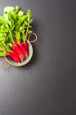 Radishes in metal bowl. Top viewの写真素材