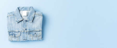 Jeans jacket on blue background