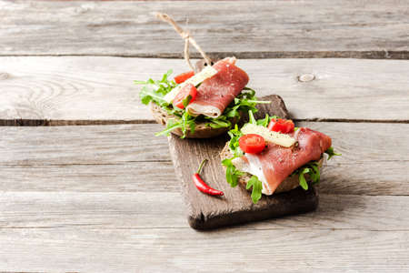 Homemade sandwich on wooden tableの写真素材