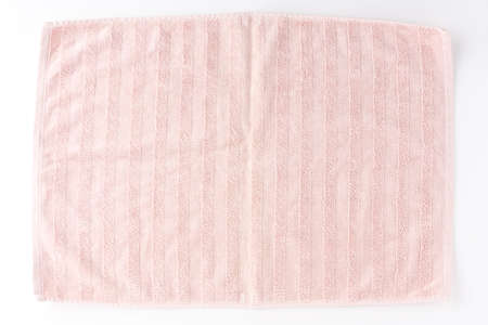 Pink beach towel isolated on white background. Top viewの写真素材