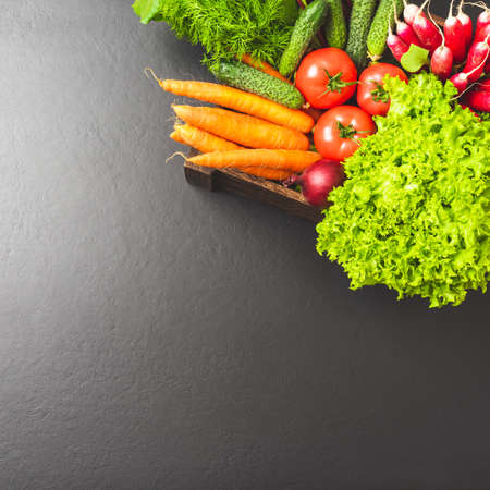 Fresh vegetables in wooden crate. Top viewの写真素材