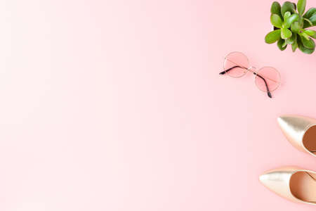 Golden high heels with sunglasses. Fashion backgroundの写真素材
