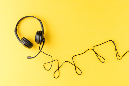 Overheadshot of headset on background with copyspace. Call center conceptの写真素材