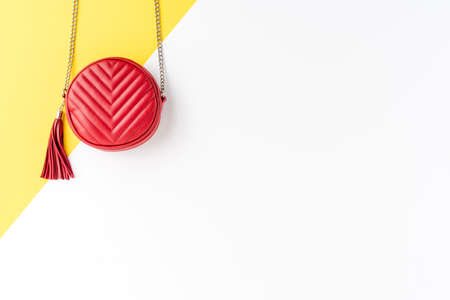 Abstract fashion background with red woman's purse. Top view. Flat layの写真素材