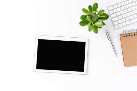 Digital tablet with empty screen isolated on white background with business accessories. Office desktopの写真素材