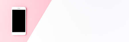 Smart phone with empty screen on abstract pink and white background with copyspace. Top view. Bannerの写真素材
