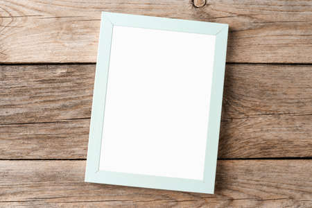 Photo frame with copyspace on wooden backgroundの写真素材
