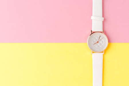 White women's watch on abstract background