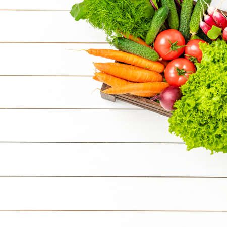 Mix of vegetables on wooden background with copyspaceの写真素材