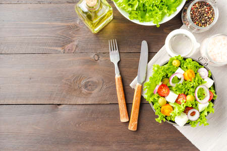 Green salad with feta on wooden background with copyspaceの写真素材