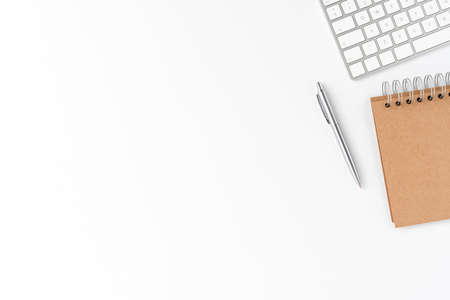 Elegant workspace with keyboard, notebook and pen. Office desktop conceptの写真素材