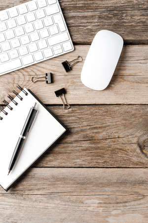 Business background with computer accessories and notebook. Top viewの写真素材