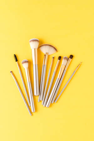 Gold makeup brushes. Top viewの写真素材