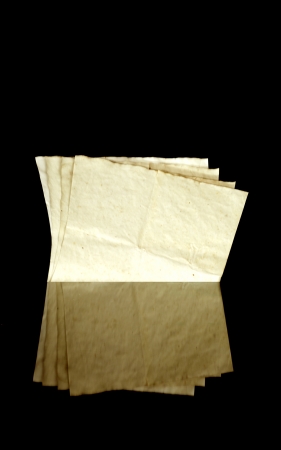 Vintage old paper pages, texture and copyspace, isolated on black backgroundの写真素材