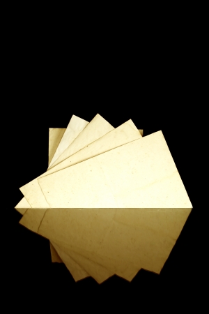 Vintage old paper pages, texture and copyspace, isolated on black backgroundの写真素材