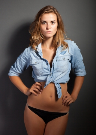 Hot natural woman body in denim jeans shirt jacket and pantiesの写真素材