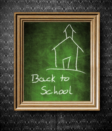 Back to School chalkboard in old wooden frame on vintage wallの写真素材