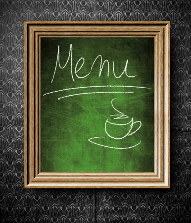 Coffee menu chalkboard in old wooden frame on vintage wallの写真素材